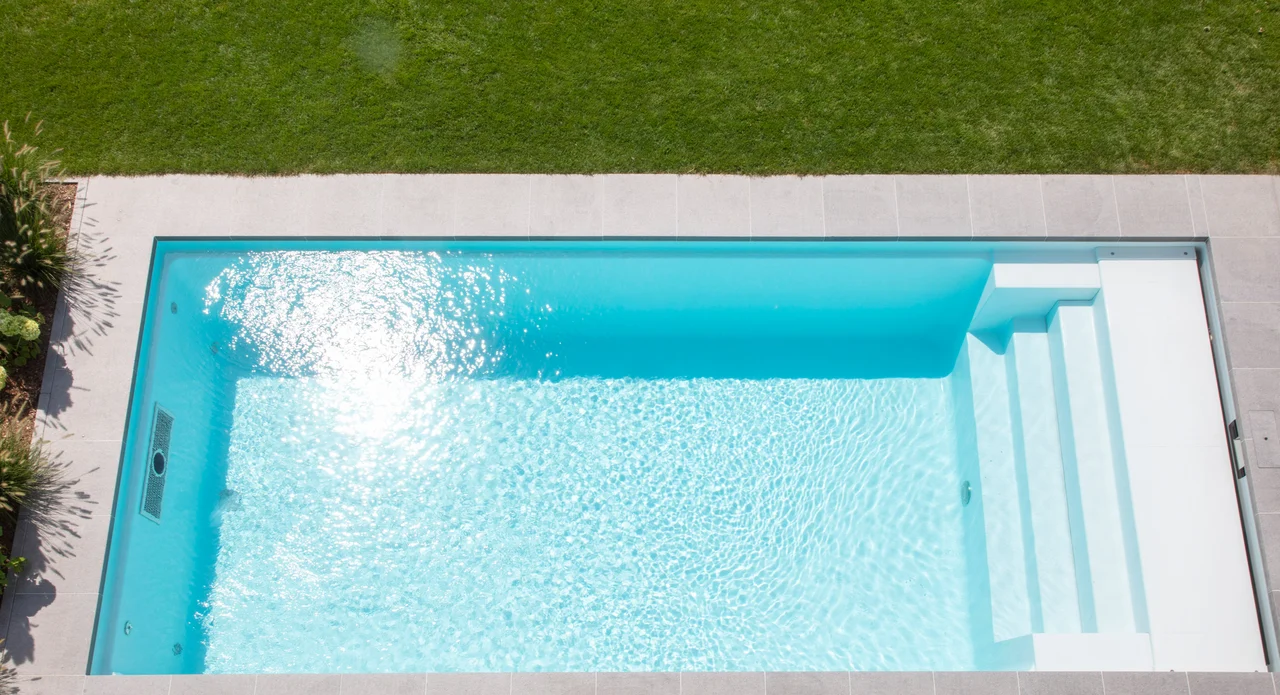 Clear water in a freshwater swimming pool with steps