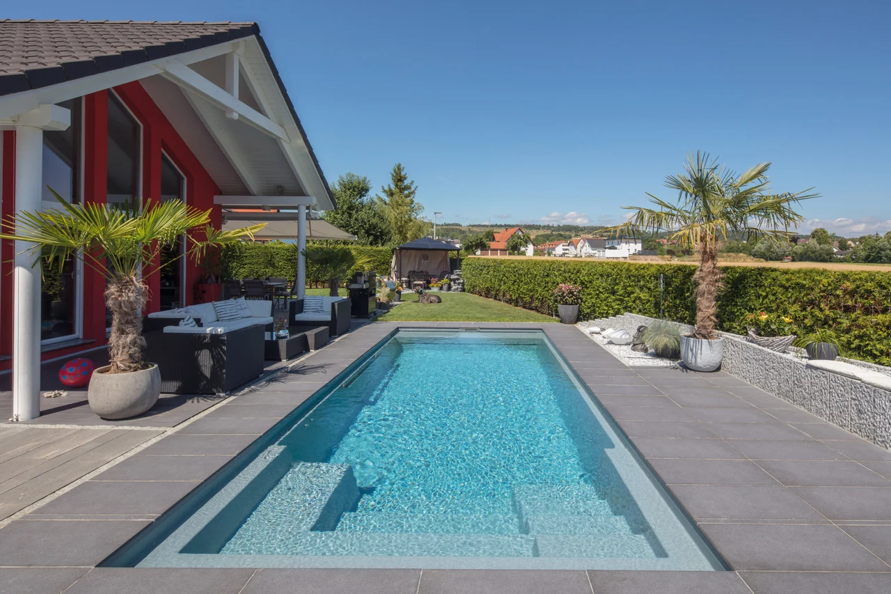 Swimming pool solar heating keeps a sunny garden pool warm for longer